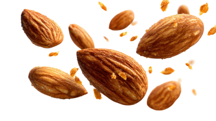 Several whole almonds and small almond pieces floating in the air isolated on transparent background