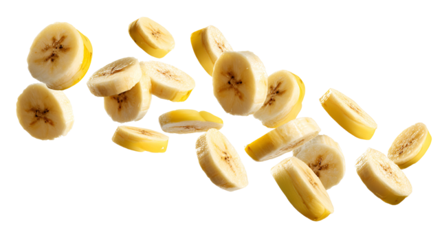 Freshly sliced banana pieces falling and floating isolated on transparent background