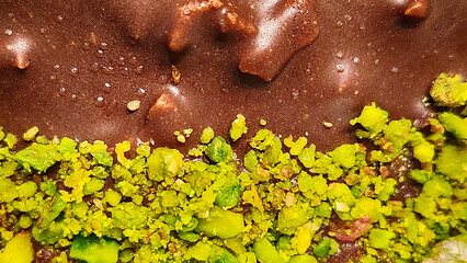chocolate and pistachio croquant cake with white cream filling