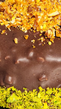 chocolate and pistachio croquant cake with white cream filling