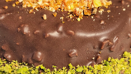 chocolate and pistachio croquant cake with white cream filling
