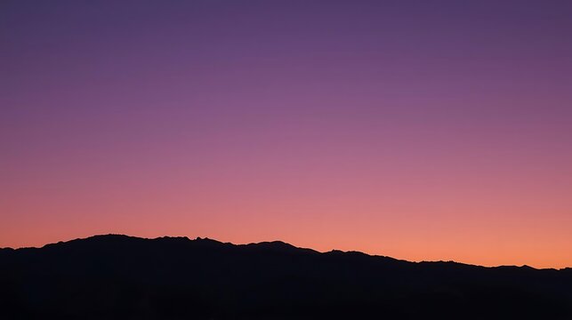 Andes mountain silhouette at dusk with gradient purple sky