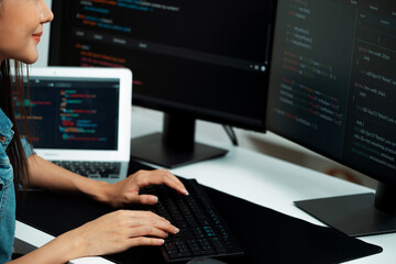 Cropped hands image of IT developer creating with typing information on pc with coding program...