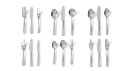 Arrangement of silverware sets on white background