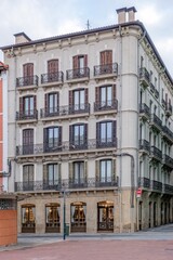 Traditional Corner Residential Building Facade with Balconies in a Spanish City