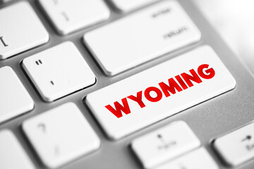 Wyoming - is a landlocked state in the Mountain West subregion of the Western United States, text concept button on keyboard © dizain