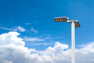 Illuminated Skies: Modern streetlights stand tall against a vibrant sky dotted with fluffy clouds. Capturing a sense of innovation and environmental harmony.