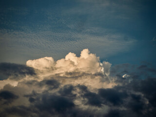 Dramatic Cumulus Clouds at Golden Hour over Blue Sky in the afternoon on West Lake in Hanoi, Vietnam