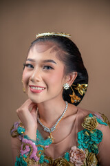 Elegant Indonesian Woman in Traditional Kebaya with Graceful Smile