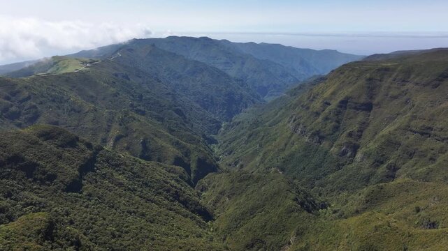 Mountains and valley on Madeira island with popular hiking trails, aerial