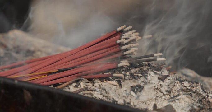 Burning incense fills the Nepali temple with sacred smoke, creating a cinematic spiritual ambience that radiates peace, devotion, and divine calm in soft warm light