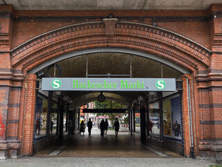 Fototapeta premium Berlin, Germany - august 3 2025: S-Bahn Train Station Tunnel With People In Central Berlin, Historic Red Brick Archway Entrance To Hackescher, Germany
