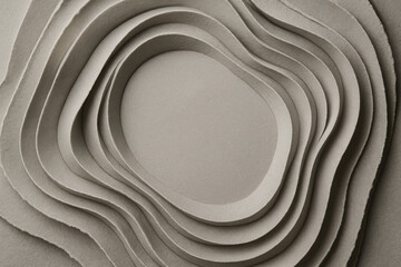 Intricate layers of textured paper create a soothing wave effect highlighting craftsmanship and artistic design
