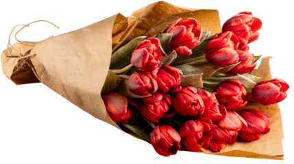 Bouquet of red tulips wrapped in kraft paper
