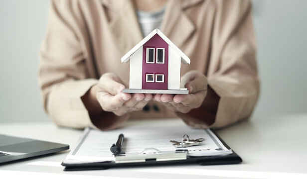 home dealer businessman signing car insurance document or lease paper. home loan and insurance concept