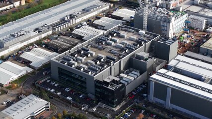 Data centers in Slough, England. Data facilities under construction. - Powered by Adobe