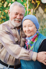 Elderly couple enjoying time together in a garden