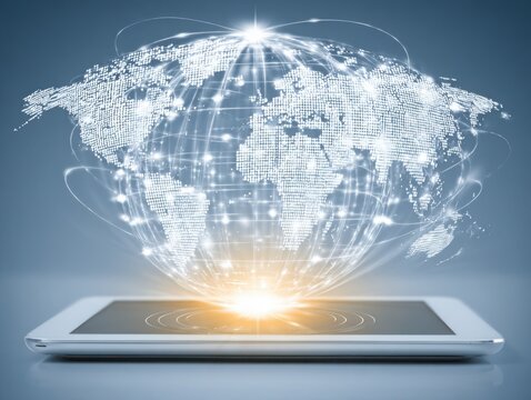 Digital globe emerging from tablet with glowing connections  