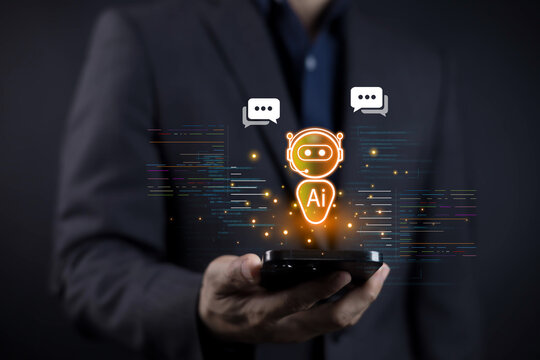 Artificial intelligence chatbot technology concept. Businessman holding smartphone with glowing AI robot icon and digital communication symbols, and smart virtual assistant solutions.