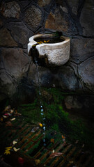 Rustic Stone Fountain with Trickling Water and Moss