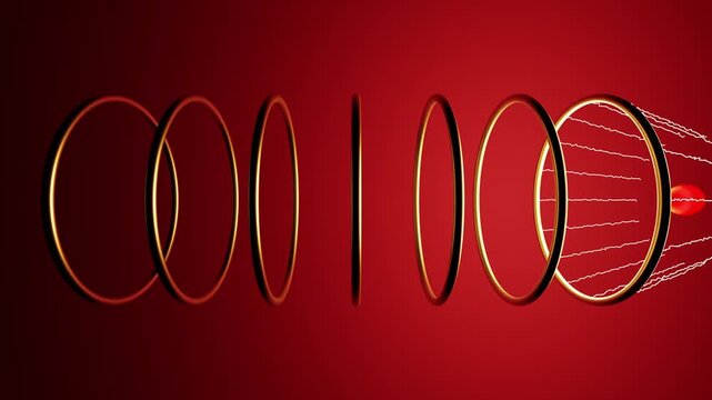 Electromagnetic particle accelerator launching a sphere through golden rings