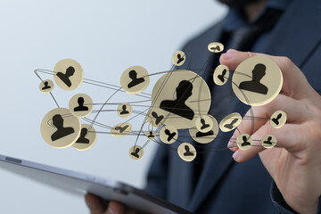 Person using a tablet computer. Digital network, technology and social connection concept represented with a graphical interface of person icons