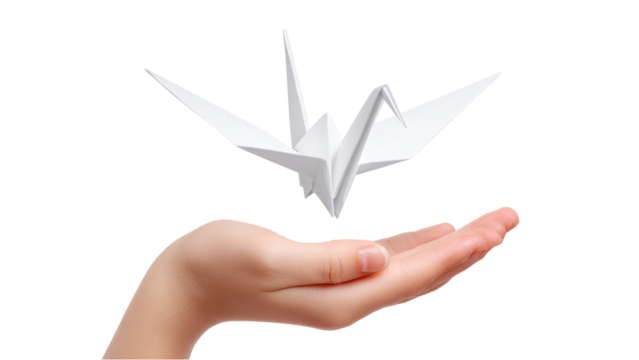 Origami Crane in Hand: Symbol of Peace, Hope, and Healing on White