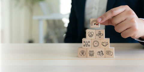 Soft skills and emotional intelligence development in leadership. Wooden blocks with soft skills icons such as empathy, communication, teamwork and emotional intelligence  in workplace.