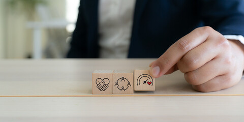 Soft skills and emotional intelligence development in leadership. Wooden blocks with soft skills icons such as empathy, communication, teamwork and emotional intelligence  in workplace.