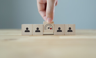 Soft Skills and Leadership concept. Building a team with emotional intelligence. Wooden blocks with emotional intelligence performance icon. Soft skills, leadership and empathy in workplace.