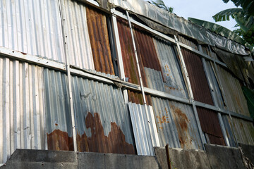 Corrugated Metal Wall Showing Rust and Wear
