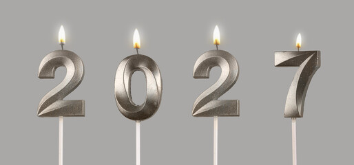 Glossy 2027 candles lit and shining, concept of holiday cheer, New Year spirit and festive