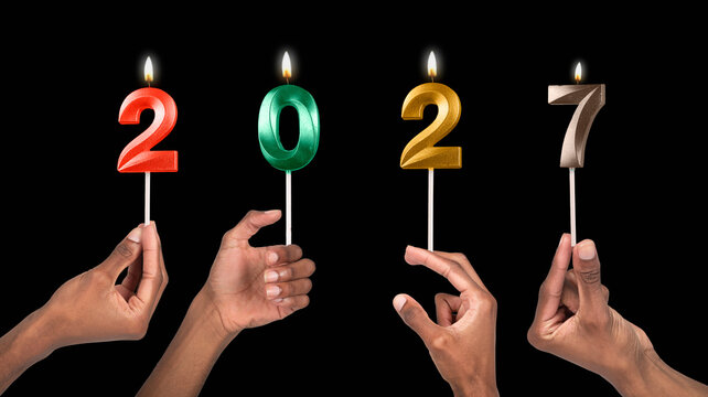 Fingers holding 2027 candle numbers representing New Year countdown, hope, joy, and celebration of - Powered by Adobe