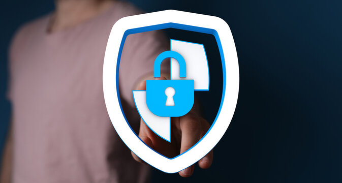 Hand holding a digital shield with padlock icon symbolizes cybersecurity and data protection. Concept represents online safety and pr