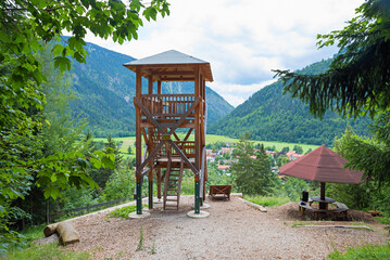 wooden lookout tower above tourist resort Bayrischzell. green summer landscape bavaria