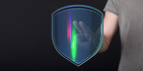 Concept of cybersecurity and digital protection represented by a hand holding a glowing shield graphic. Ideal for themes of security,