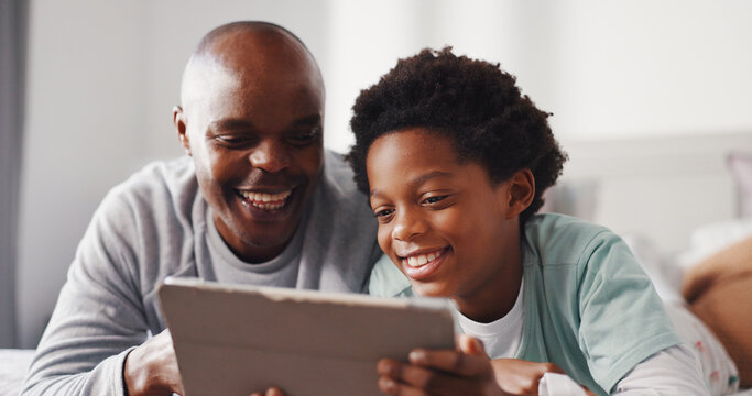 Tablet, relax and father with kid on bed in home for watching movie, series or show together. Happy, bonding and African dad with child for streaming film on digital technology in bedroom at house. - Powered by Adobe