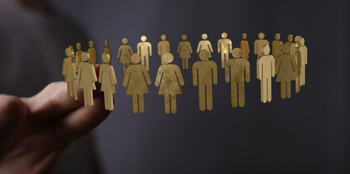 Golden figurines represent community, teamwork, and human connections in this symbolic and abstract image. Perfect for concepts of unity and tog