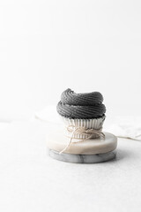 grey frosting on cupcakes with a white background, cupcakes in white liners with tall buttercream swirl, grey buttercream frosted cupcakes on a white background