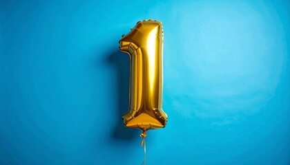 Gold Number One Balloon on Blue Background Symbolizing Celebration and Editorial Styling for Milestone Events