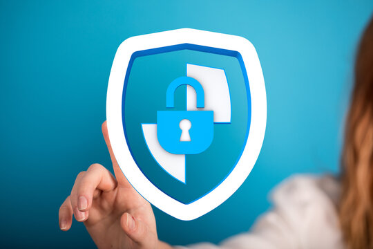Image of a woman touching a security shield with a padlock symbolizing data protection, cybersecurity, and digital safety. Perfect fo