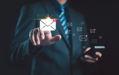 Businessman touching digital email icon with new message notification, representing online communication, email marketing, digital network, and business connection in modern technology concept.