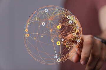 Abstract image of a hand holding a glowing sphere representing global network, connection,...