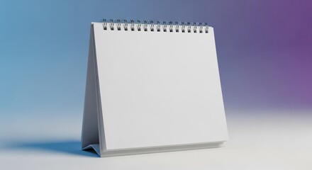 Blank spiral bound desk calendar with white pages and grey base, isolated on a gradient background
