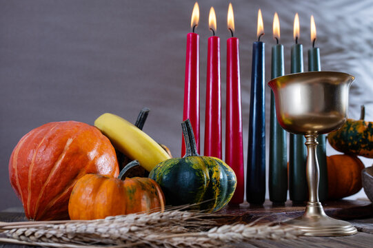 Kwanzaa, african holiday Kwanzaa with decoration of seven candles in red, black and green colors, vegetable harvest, corn. Greeting card banner. Happy Kwanzaa