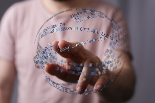 A close-up of a human hand interacting with a glowing data sphere, representing technology, information, and the digital world, suita