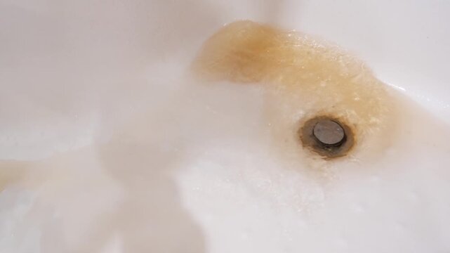 Cleaning a bathtub drain and removing stains effectively