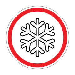 Circular warning sign with a black snowflake icon inside a red border on a white background. Symbol represents icy or cold conditions, frost warning, winter hazard, and safety alert.