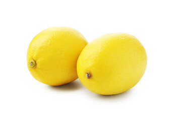 Two whole ripe lemons isolated on white