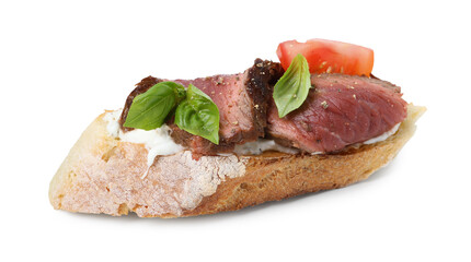 Delicious bruschetta with roast beef, cream cheese, tomato and basil isolated on white